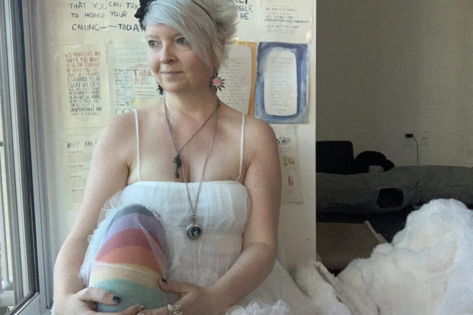 Patti Bryant sitting by a window in a reflective moment