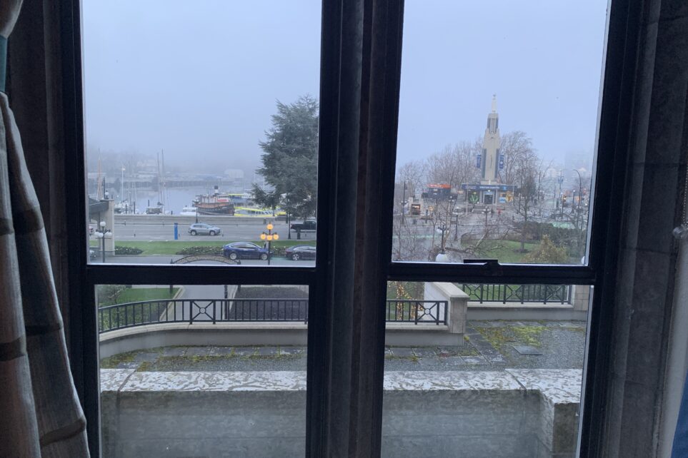 Foggy city view seen through a hotel window